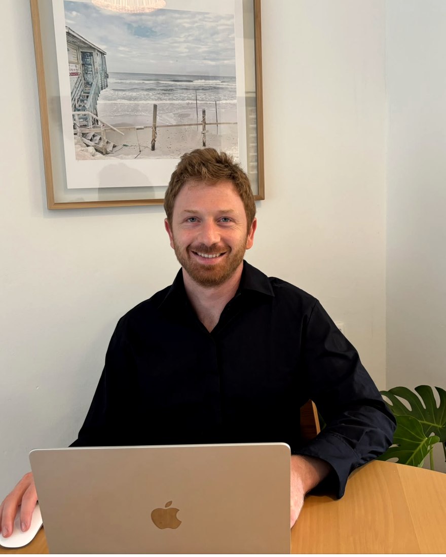 Idan Ron working at his desk